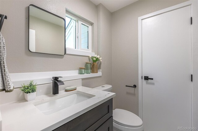 5195 Allison St, Arvada, CO 80002 - bathroom with toilet and vanity
