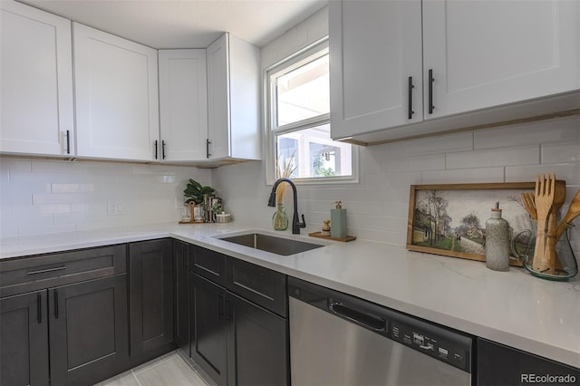5195 Allison St, Arvada, CO 80002 - kitchen featuring dishwasher, white cabinets, and tasteful backsplash