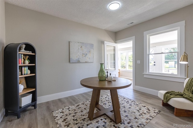 5195 Allison St, Arvada, CO 80002 - sitting room with a textured ceiling and light wood finished floors