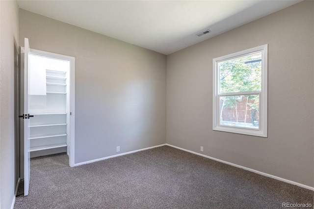5195 Allison St, Arvada, CO 80002 - unfurnished bedroom with carpet flooring and a walk in closet