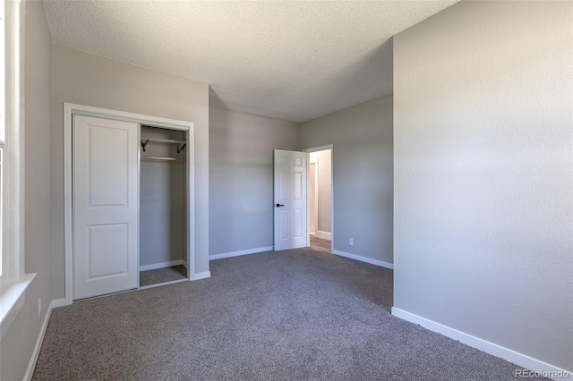 5195 Allison St, Arvada, CO 80002 - unfurnished bedroom featuring carpet floors, a closet, and a textured ceiling