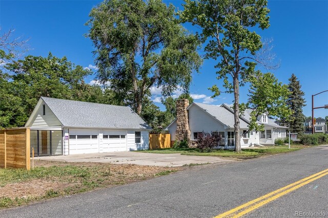 5195 Allison St, Arvada, CO 80002 - view of front facade with a detached garage and an outbuilding