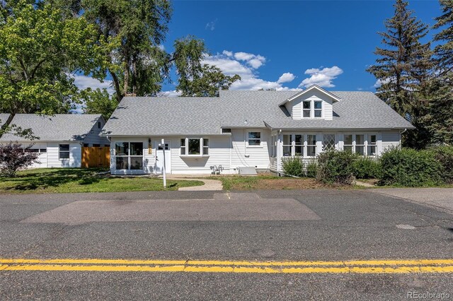 5195 Allison St, Arvada, CO 80002 - view of front of house with a front lawn and a shingled roof
