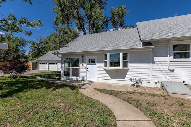 5195 Allison St, Arvada, CO 80002 - view of front of property featuring a front lawn and a shingled roof