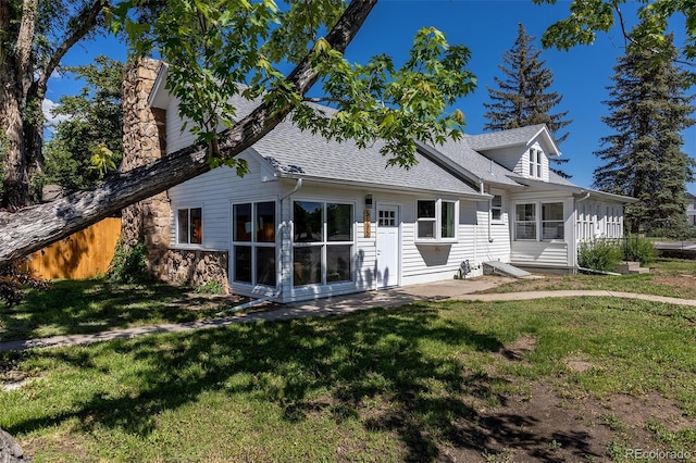 5195 Allison St, Arvada, CO 80002 - back of house featuring roof with shingles, a chimney, and a lawn