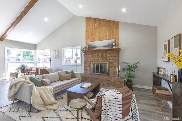5195 Allison St, Arvada, CO 80002 - living room with high vaulted ceiling, wood finished floors, a brick fireplace, and recessed lighting