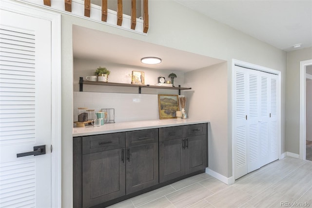 5195 Allison St, Arvada, CO 80002 - bar with tasteful backsplash and baseboards