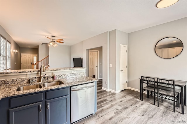 23882 E Alabama Dr, Aurora, CO 80018 - kitchen with dishwasher, a sink, light wood-style floors, a ceiling fan, and light stone counters