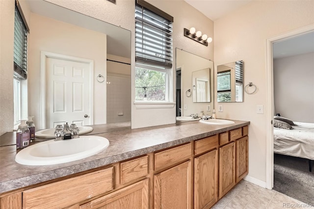 23882 E Alabama Dr, Aurora, CO 80018 - full bath with connected bathroom, double vanity, and tile patterned flooring