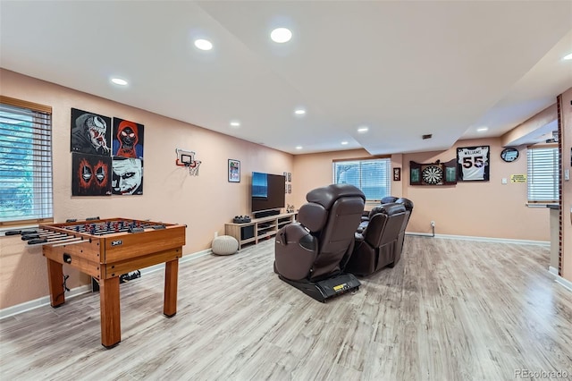 23882 E Alabama Dr, Aurora, CO 80018 - game room with wood finished floors, baseboards, recessed lighting, and plenty of natural light