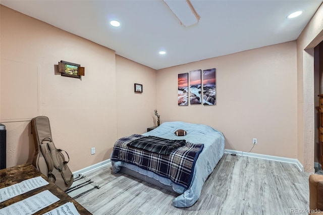 23882 E Alabama Dr, Aurora, CO 80018 - bedroom with baseboards, wood finished floors, and recessed lighting