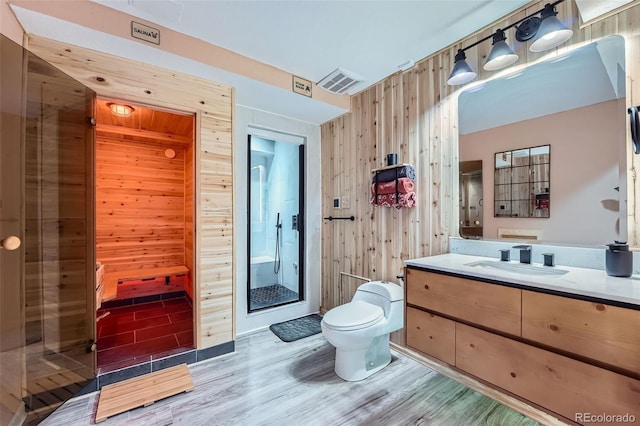 23882 E Alabama Dr, Aurora, CO 80018 - full bath with wooden walls, toilet, a relaxing sauna, a shower stall, and vanity