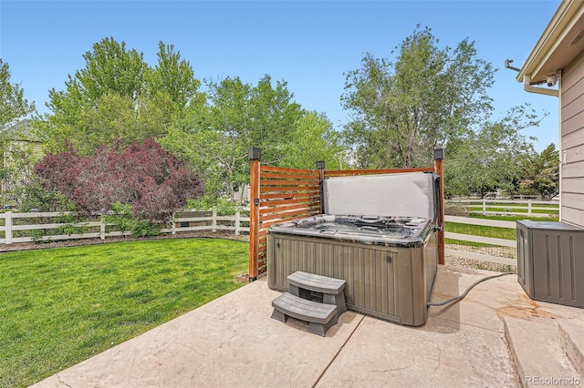 23882 E Alabama Dr, Aurora, CO 80018 - view of patio / terrace with a hot tub