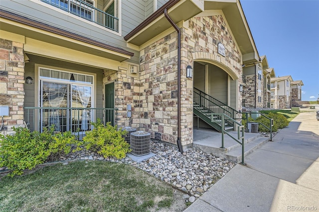 18657 Stroh Rd Unit 4103, Parker, CO 80134 - property entrance featuring stone siding and central AC