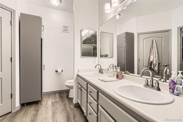 18657 Stroh Rd Unit 4103, Parker, CO 80134 - bathroom featuring double vanity, toilet, and wood finished floors