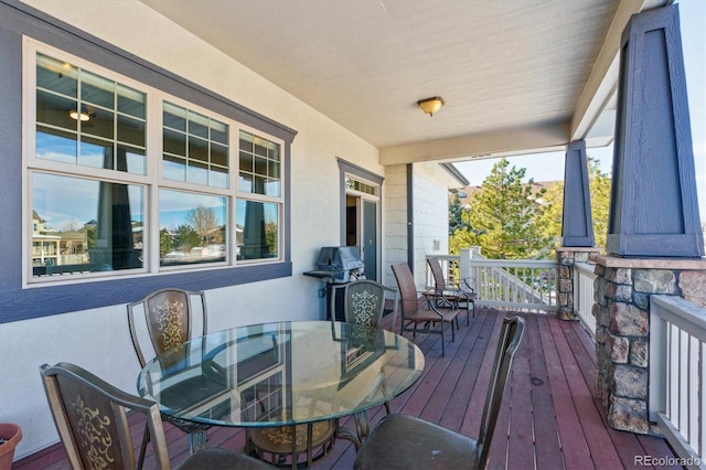 wooden deck featuring area for grilling