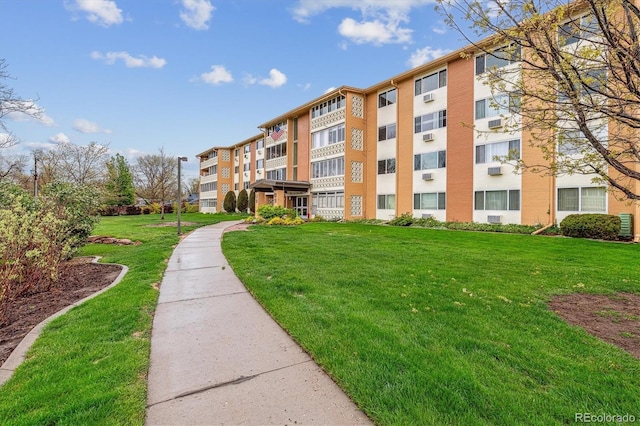 view of home's community with a lawn