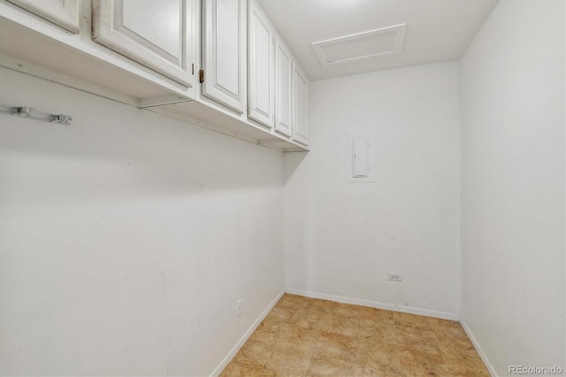 laundry room with baseboards