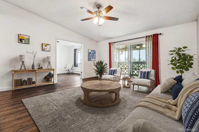 795 S Alton Way Unit 5D, Denver, CO 80247 - living area with vaulted ceiling, ceiling fan, wood finished floors, baseboards, and a baseboard radiator