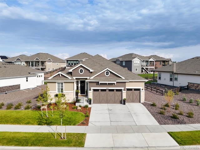 8890 S Quatar Ct, Aurora, CO 80016 - view of front of home with a residential view, concrete driveway, an attached garage, and a shingled roof