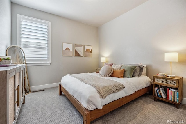 8890 S Quatar Ct, Aurora, CO 80016 - bedroom with light colored carpet and baseboards