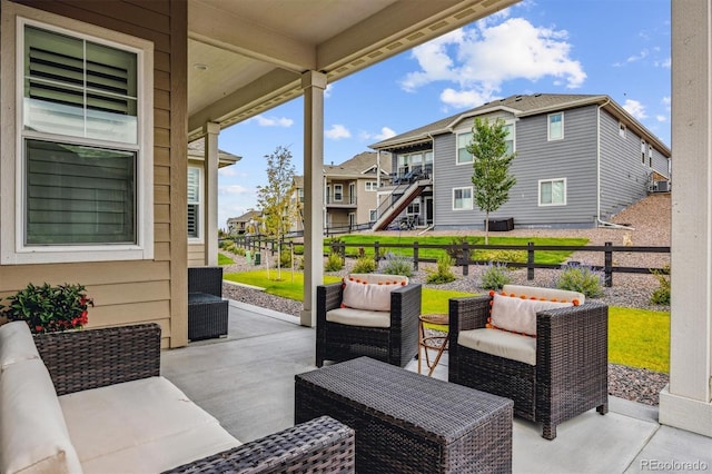 8890 S Quatar Ct, Aurora, CO 80016 - view of patio with an outdoor living space and a residential view