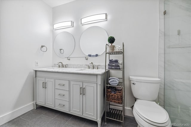 bathroom featuring tile patterned floors, toilet, and vanity