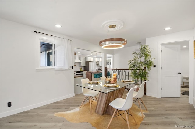 dining area with light wood-type flooring