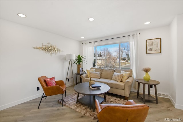 living room with light hardwood / wood-style flooring