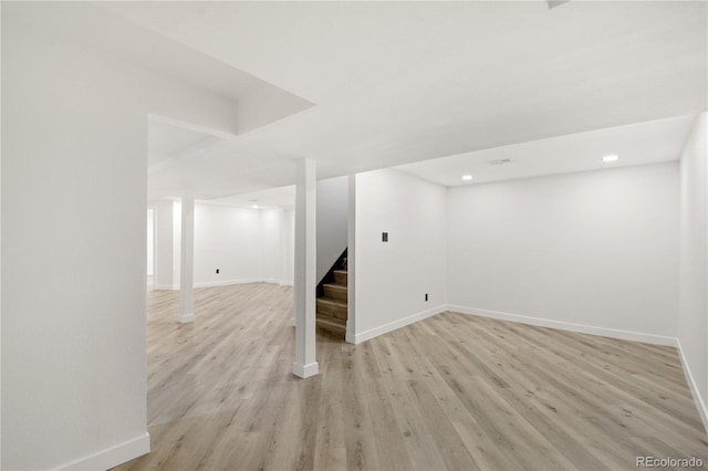 basement featuring light hardwood / wood-style floors