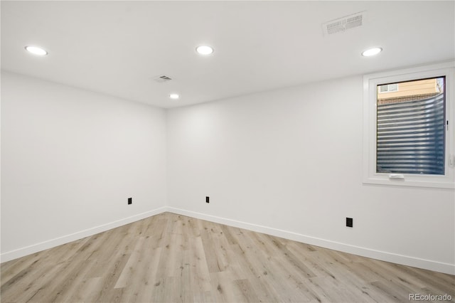 spare room featuring light wood-type flooring