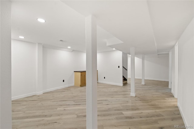 basement featuring light wood-type flooring