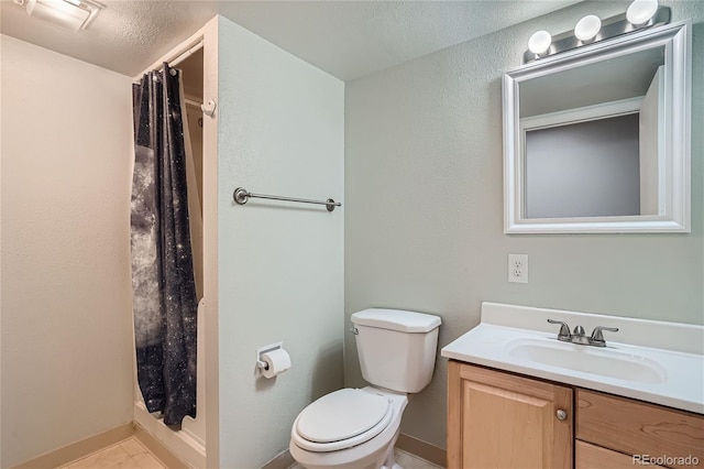 bathroom featuring toilet, a shower with curtain, a textured ceiling, vanity, and tile patterned flooring