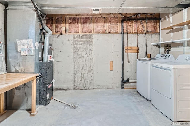 basement featuring washer and clothes dryer