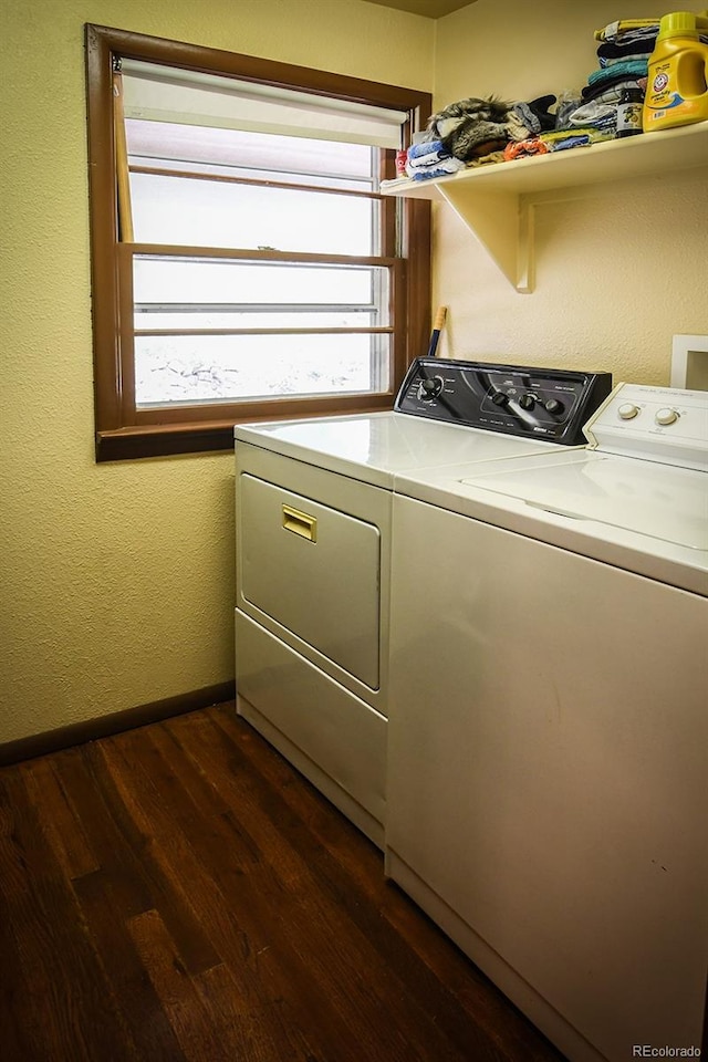 8946 Central Ave, Beulah, CO 81023 - washroom featuring washing machine and clothes dryer, dark wood-type flooring, and baseboards