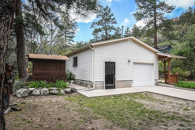 8946 Central Ave, Beulah, CO 81023 - garage featuring concrete driveway