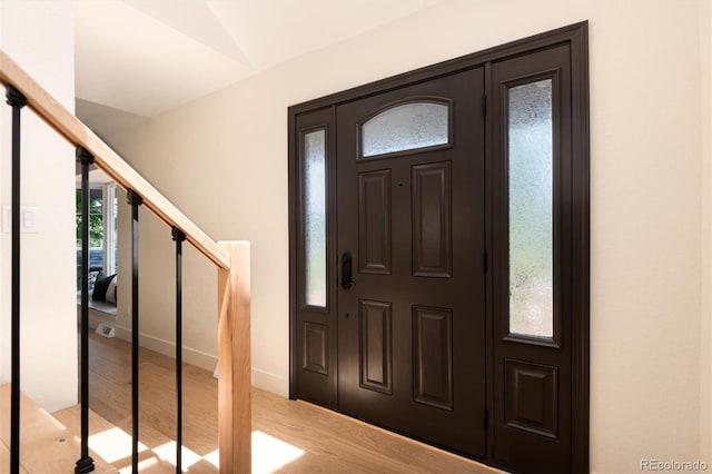 6097 S Jackson St, Centennial, CO 80121 - foyer with light wood-style floors and stairway