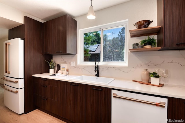 6097 S Jackson St, Centennial, CO 80121 - kitchen with white appliances, dark brown cabinetry, and light countertops