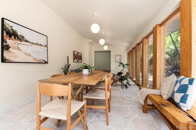 6097 S Jackson St, Centennial, CO 80121 - dining space featuring stone flooring and lofted ceiling