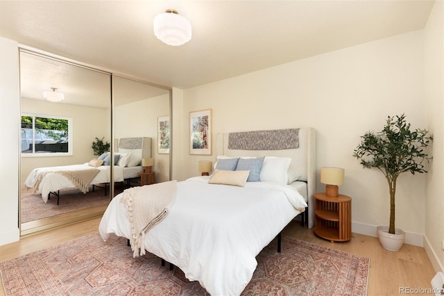 6097 S Jackson St, Centennial, CO 80121 - bedroom with wood finished floors and a closet