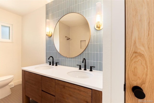 6097 S Jackson St, Centennial, CO 80121 - full bathroom featuring double vanity, tile walls, and backsplash