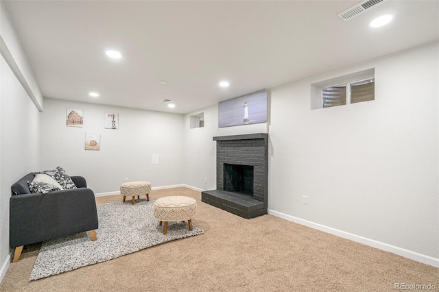 living room featuring a fireplace and carpet flooring