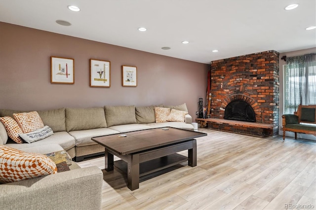 6495 E Happy Canyon Rd Unit 163, Denver, CO 80237 - living room with light wood-style floors, recessed lighting, and a brick fireplace