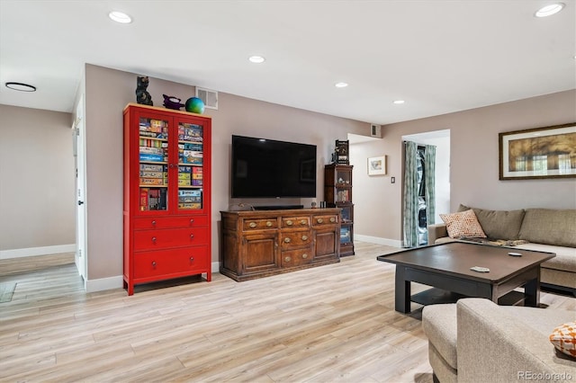6495 E Happy Canyon Rd Unit 163, Denver, CO 80237 - living area with baseboards, light wood finished floors, and recessed lighting