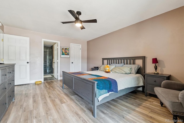 6495 E Happy Canyon Rd Unit 163, Denver, CO 80237 - bedroom with light wood-style floors, ensuite bathroom, and ceiling fan