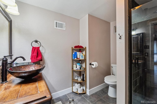 6495 E Happy Canyon Rd Unit 163, Denver, CO 80237 - full bath with a shower stall, tile patterned floors, and vanity