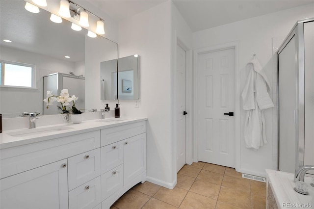 8884 Miners St, Highlands Ranch, CO 80126 - bathroom featuring a shower stall, double vanity, and tile patterned floors