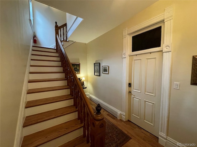 2335 Stout St, Denver, CO 80205 - staircase featuring wood finished floors and baseboards