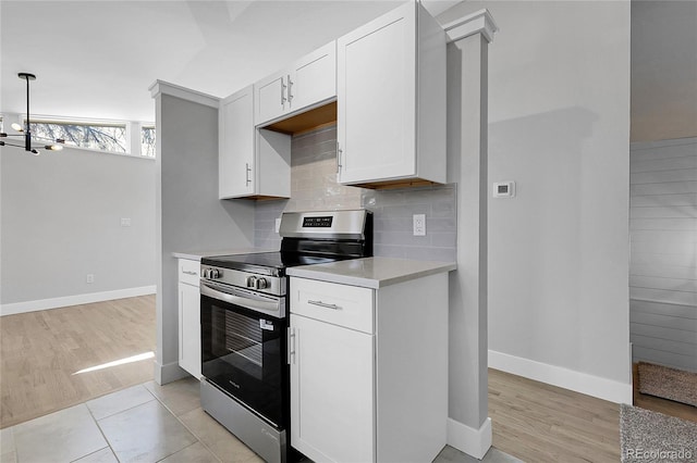 5373 S Prescott St, Littleton, CO 80120 - kitchen with stainless steel electric range oven, light countertops, baseboards, and backsplash