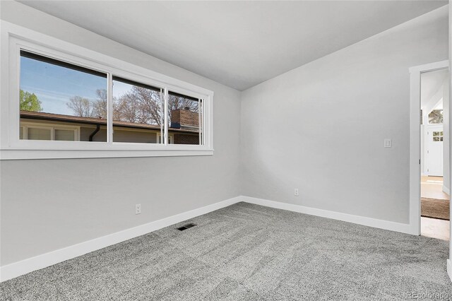 5373 S Prescott St, Littleton, CO 80120 - spare room featuring baseboards, carpet floors, and healthy amount of natural light